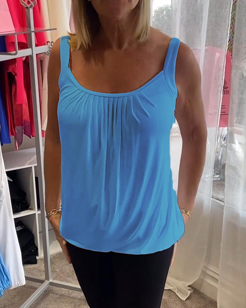 Casual sleeveless top with pleats and solid color