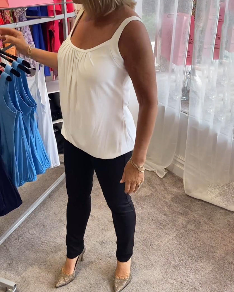 Casual sleeveless top with pleats and solid color