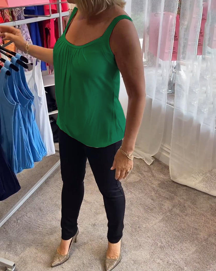 Casual sleeveless top with pleats and solid color
