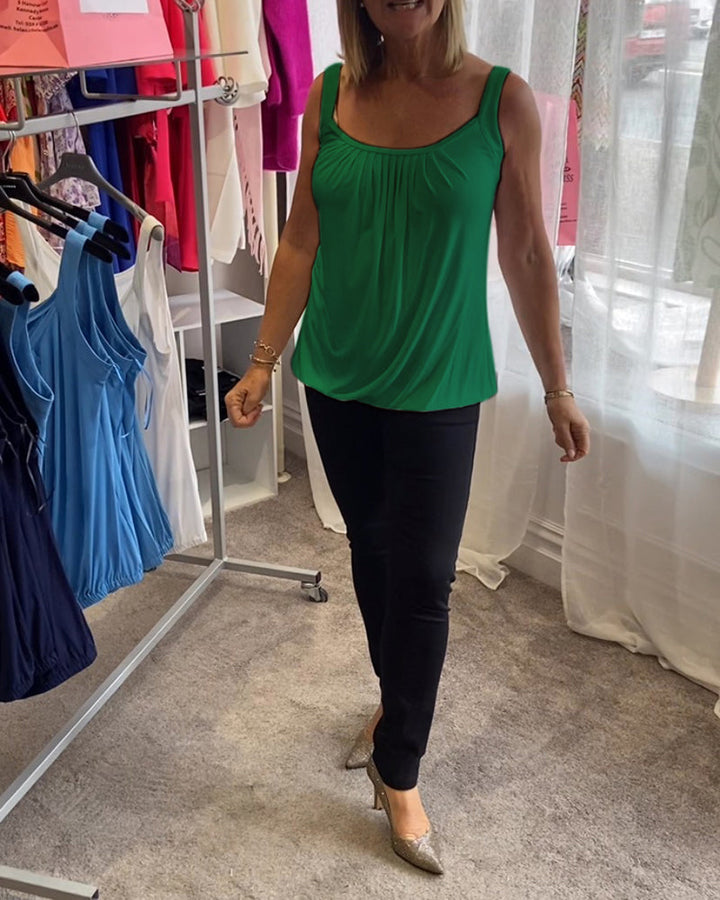 Casual sleeveless top with pleats and solid color