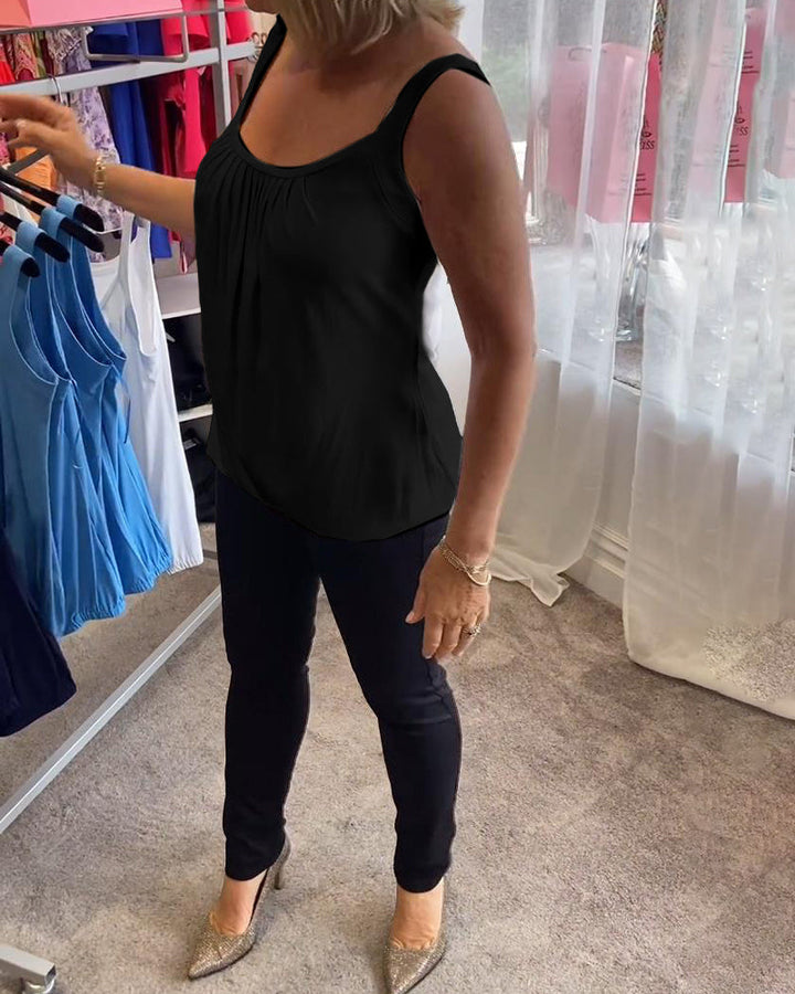 Casual sleeveless top with pleats and solid color