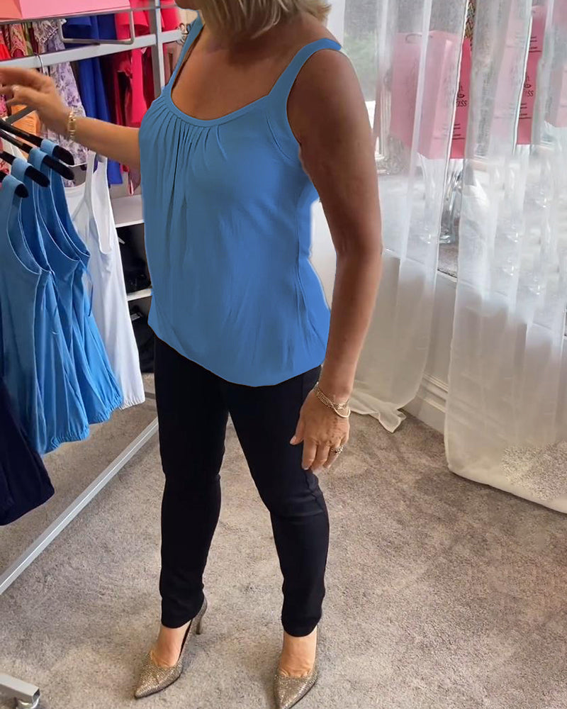Casual sleeveless top with pleats and solid color