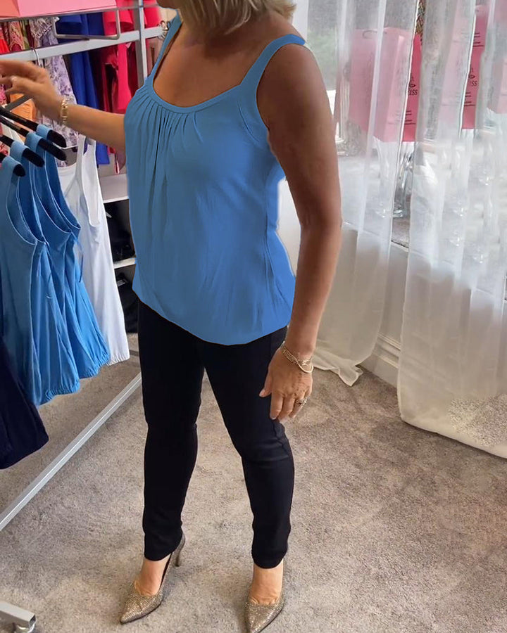 Casual sleeveless top with pleats and solid color
