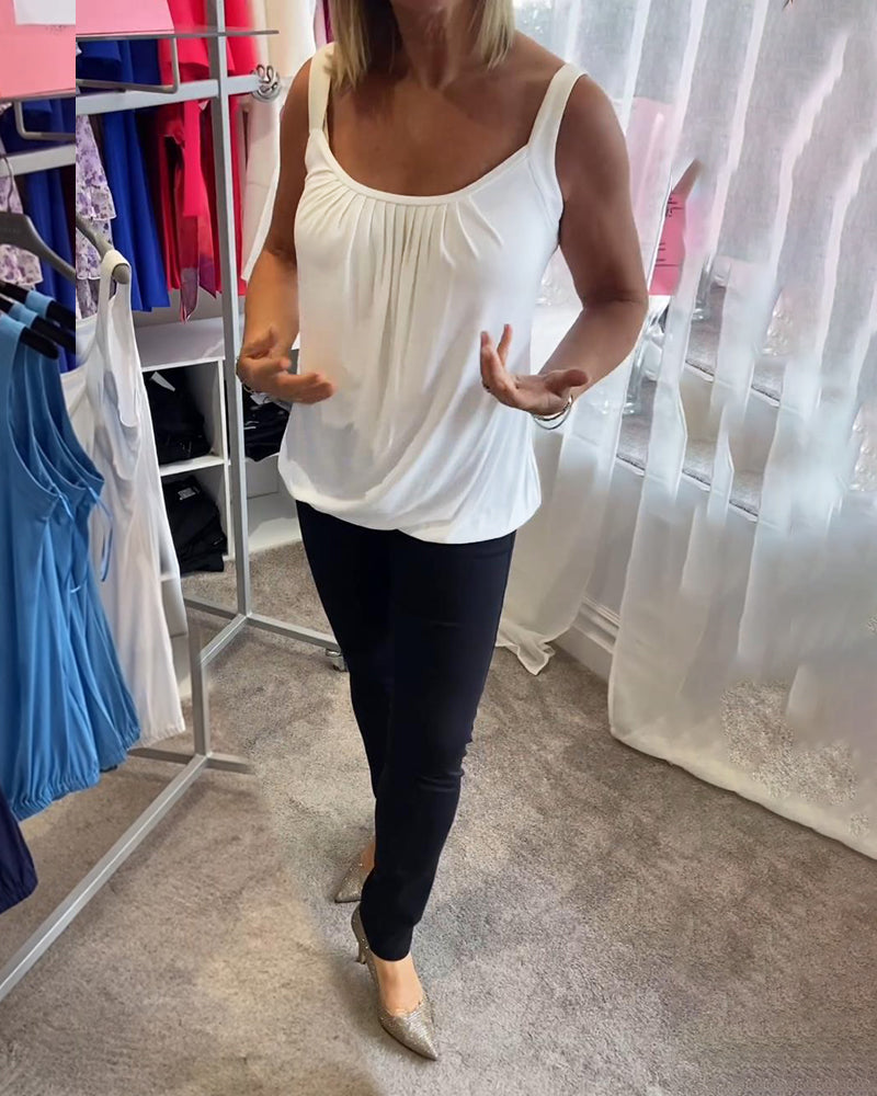 Casual sleeveless top with pleats and solid color