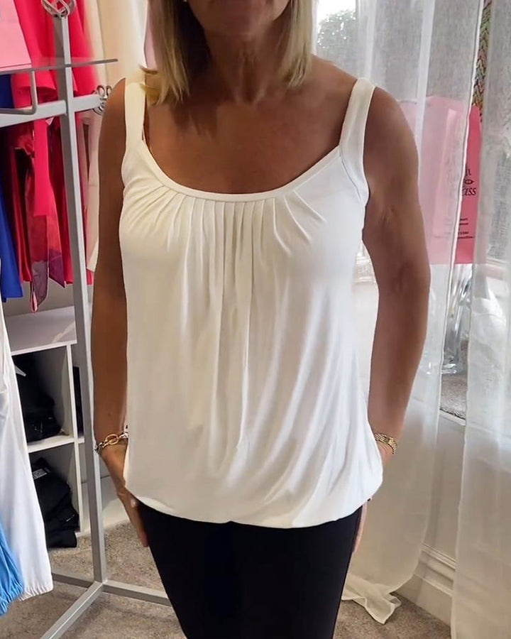 Casual sleeveless top with pleats and solid color